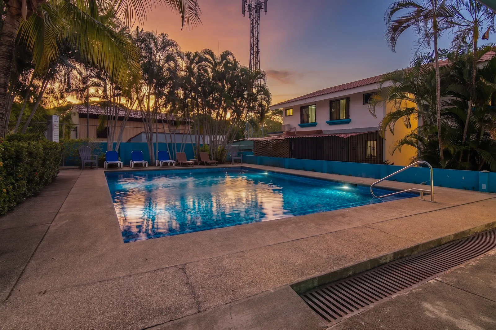 Twilight view of the community pool at Aquamarine, Las Palmas