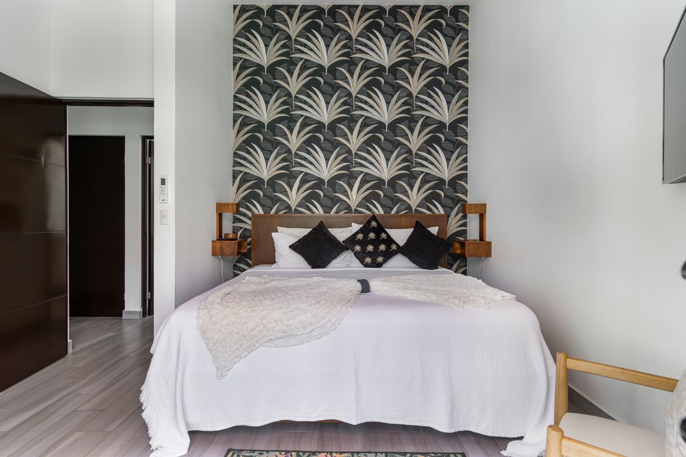 Bedroom interior with designer wallpaper accent wall